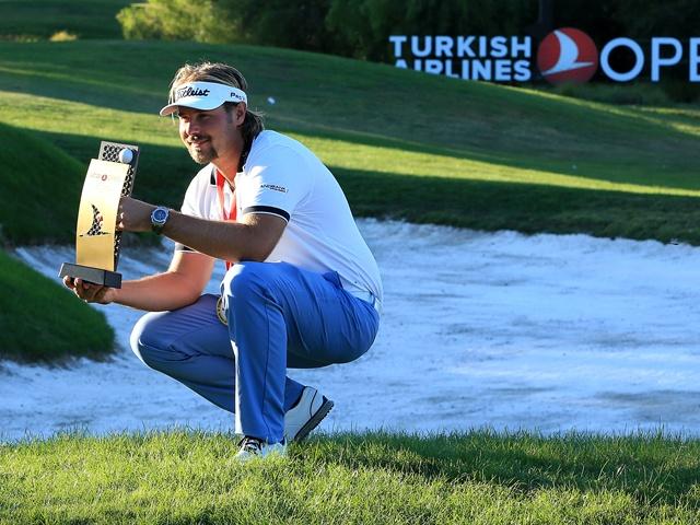 Victor Dubuisson holding Turkish Airlines Open trophy for a second time